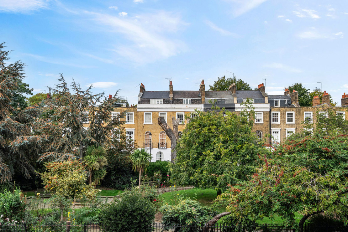 View across Gibson Square Gardens surrounded by period townhouses in Barnsbury